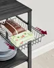 A close-up shot of a pull-out basket on a shelf, containing coffee beans and chocolates. Produktbild-Vorschau