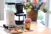 A coffee maker with a cup of coffee and pastries on a table. Produktbild-Vorschau