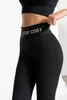 Close-up of a person wearing black leggings. Produktbild-Vorschau