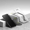 A smartphone, a screen protector, and a phone case are arranged on a textured surface with a light gray background. Produktbild-Vorschau