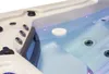 A close-up view of a white disc floating on the surface of blue water in a hot tub. Produktbild-Vorschau