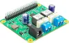 A close-up, angled view of a green circuit board with various electronic components, including capacitors, transformers, and terminal blocks. Anteprima dell’immagine prodotto