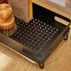 A close-up view of a kitchen sink organizer tray holding a dish brush and a sponge. Voir les images du produit