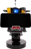 A robot-shaped phone stand with a phone placed on it. Anteprima dell’immagine prodotto