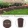 A garden fence made of brown plastic in a wood-like design, bordering a lawn and flower bed. Náhled obrázku produktu