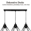 A close-up view of a black pendant light fixture with three diamond-shaped metal cages hanging from a rectangular black base. Produktbild-Vorschau