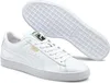 A pair of white Puma sneakers, with one shoe shown from the side and the sole of the other shoe shown from underneath. Produktbild-Vorschau