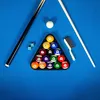 A billiard table with balls racked in a triangle, cues, and chalk. Produktbild-Vorschau