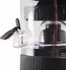 Close-up view of a juicer's dispensing mechanism and part of the base. Produktbild-Vorschau