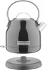 A black KitchenAid electric kettle is shown with its power base separated. Produktbild-Vorschau