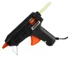 A black and orange hot glue gun with a beige glue stick inserted. Produktbild-Vorschau
