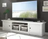 A white TV stand with a large television on top, set against a dark gray wall. Produktbild-Vorschau