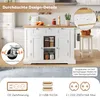 A white kitchen island with a wooden countertop is shown in a kitchen setting. Various features and certifications are highlighted with text overlays and icons. Produktbild-Vorschau
