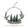 A decorative Christmas wreath with miniature trees and baubles, hanging from a string. Anteprima dell’immagine prodotto