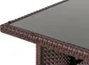 Close-up of the corner of a poly-rattan table with a glass top. Produktbild-Vorschau