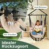 A split image showing a hammock chair used outdoors in a garden and indoors in a room, with text overlays. Produktbild-Vorschau
