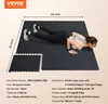 A woman is doing a push-up on a black interlocking floor mat. The mat has white dots. Dimensions are shown on the image. Voir les images du produit