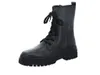 A black lace-up boot on a white background. Produktbild-Vorschau