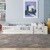 A white children's bed with a guardrail is set up in a room with a light blue wall and a gray carpet. Produktbild-Vorschau