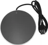 A close-up, top-down view of a round, black USB-powered mug warmer with a silver rim, connected to a black USB cable. Podgląd zdjęcia produktu