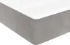 A close-up view of a mattress with a grey base and white top. Produktbild-Vorschau