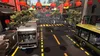 A street scene in a Chinatown-like environment with buses and pedestrians. Produktbild-Vorschau