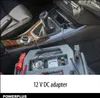 Interior of a car with a car jump starter device plugged into the 12V DC adapter. Produktbild-Vorschau