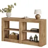 A wooden console table with shelves, decorated with a vase of greenery, a bowl of nuts, a lamp, books, and lanterns. Produktbild-Vorschau
