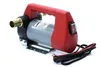 A 12V oil pump with a red plastic handle and a gray motor housing, shown against a white background. Náhled obrázku produktu