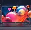 A digital rendering of a TV screen displaying a vibrant, abstract image of colorful spheres and liquid-like shapes, with the brand name 'TuTu' visible on the screen's bezel. Produktbild-Vorschau