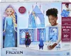 The image shows the retail packaging for a Disney Frozen Elsa's Crystal Castle toy set. It features a large doll of Elsa, a smaller doll of Anna, and figures of Olaf and a castle playset. A child is shown interacting with the toy. Náhľad obrázku produktu