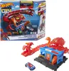 The image shows the box of a Hot Wheels City Scorpion Flex Attack playset, along with the assembled playset and a toy car. Voir les images du produit