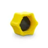 A yellow plastic cap with a black insert, shown against a white background. Produktbild-Vorschau