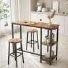 A kitchen or dining area with a bar table and stools, set up for a meal. Produktbild-Vorschau