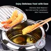 A deep fryer with fried shrimp and a thermometer. Podgląd zdjęcia produktu