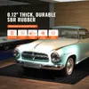 A vintage car is parked on a black rubber mat in what appears to be a showroom or garage. Produktbild-Vorschau