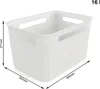 A white plastic storage basket with dimensions indicated by measurement lines and text. Voir les images du produit