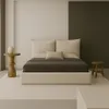 A minimalist bedroom scene featuring a bed. Produktbild-Vorschau