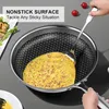 A person is using a spatula to flip an omelet in a nonstick frying pan. Náhľad obrázku produktu