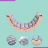 A collage of images showing a wooden rocking arch with a gray padded cushion, and close-ups of its features. Produktbild-Vorschau