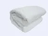 A folded white duvet on a light gray background. Produktbild-Vorschau