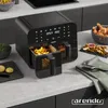 A modern kitchen countertop scene featuring a black dual-chamber air fryer with french fries and fried chicken. Produktbild-Vorschau