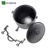 A black cast iron pot with a lid and a metal stand, displayed on a white background. Podgląd zdjęcia produktu