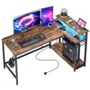 A gaming L-shaped desk with dual monitors, keyboard, mouse, computer tower, laptop, and accessories. Anteprima dell’immagine prodotto