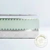 A cross-section of a mattress showing its layers, with a quality seal on the side. Produktbild-Vorschau
