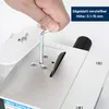 A hand is using an Allen wrench to adjust the height of a mini table saw blade. Produktbild-Vorschau