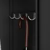A close-up view of hooks inside a black cabinet, with an umbrella hanging from one of the hooks. Produktbild-Vorschau