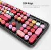 A close-up, angled view of a colorful, retro-style keyboard with round keys. Náhled obrázku produktu
