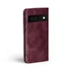 A burgundy flip case for a Google Pixel 8 phone, shown from the side. Produktbild-Vorschau