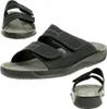 A collage of three views of a black sandal. Anteprima dell’immagine prodotto
